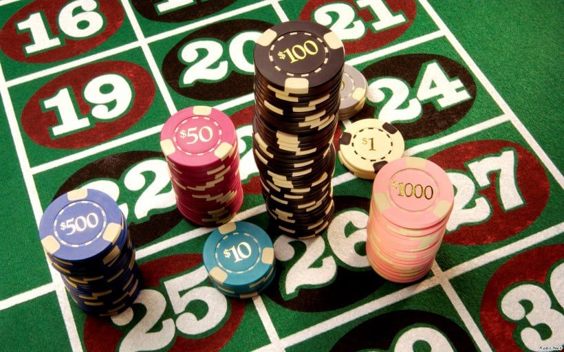 Live casino studio with multiple gaming tables and professional dealers